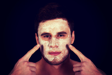 Man with cream moisturizer on his face.