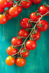 cherry tomatoes over turquoise background