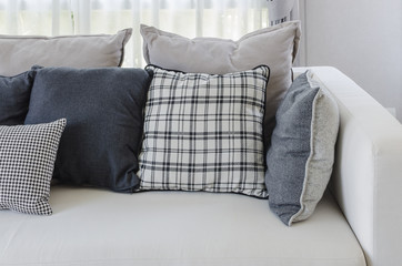 pillows on modern white sofa in living room