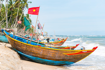 Vietnamese fishing coracles on beach, tribal boats at fishing village