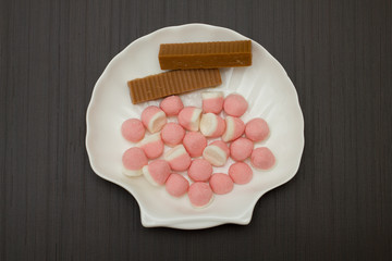 Pink marmalade in sugar with two stick iris