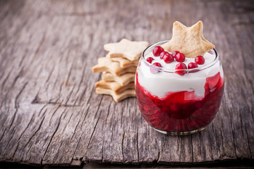 Dessert with cranberry sauce and sour cream decorated gingerbread cookies © annaileish