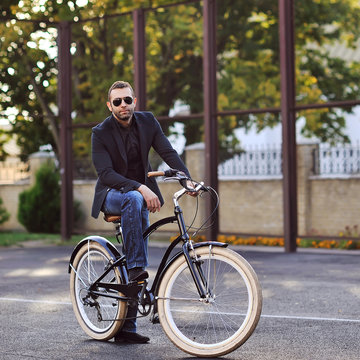 Young man on a vintage bicycle outdoor