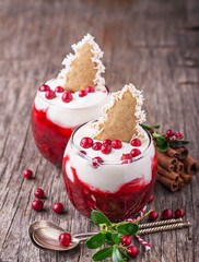 Festive dessert with cranberry sauce, sour cream and ginger biscuits