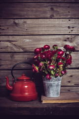 red flowers and enamel kettle