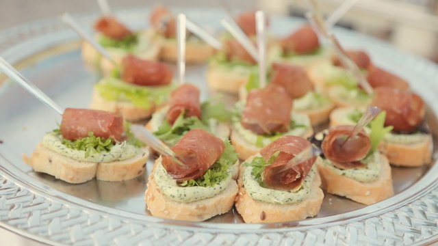 Delicious sandwiches with cream cheese, leaf of lettuce and a