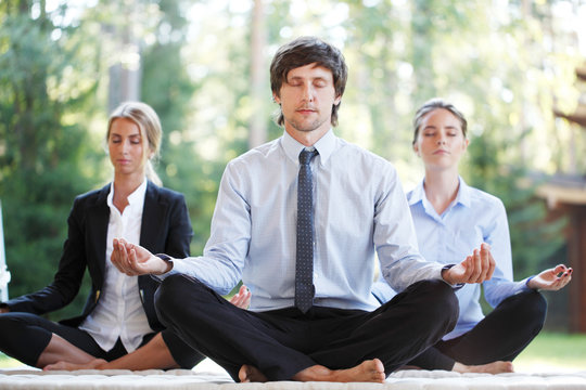 Business People Doing Yoga