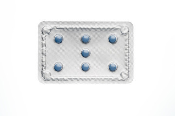 Blue pills in blister package isolated on white background.