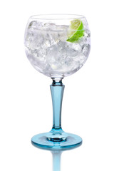 Glass with gin, tonic, lime and ice