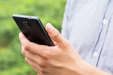 Man using his Mobile Phone outdoor