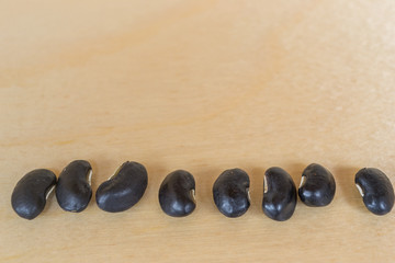 black beans on wood background