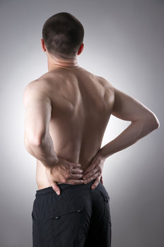 Kidney pain. Man with backache. Pain in the man's body