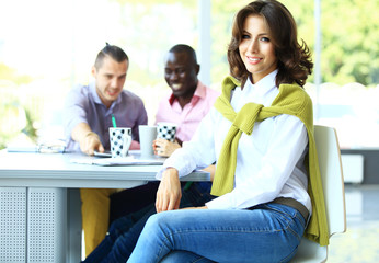 Face of beautiful woman on the background of business people