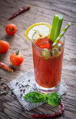 Bloody Mary cocktail on the wooden background