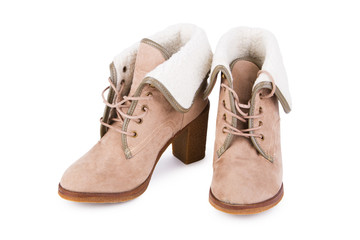 Stylish female beige leather ankle boots, isolated on white