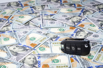 Car keys on american dollars money background