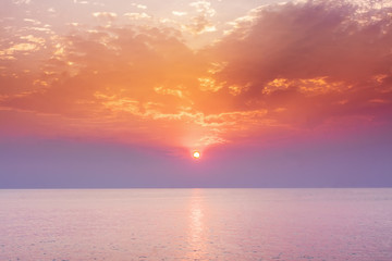 Sunset sky above sea, sunrise landscape