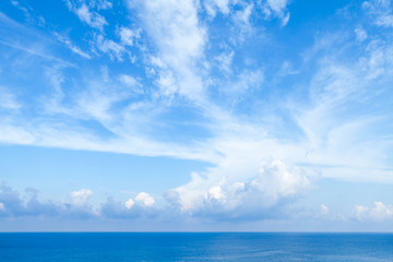 Sea landscape with bright blue cloudy sky