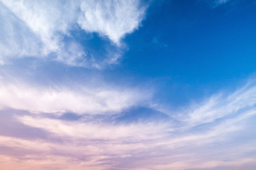 Naklejka na ściany i meble Blue and pink cloudy sky background photo
