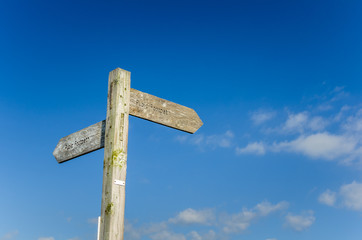 Public Footpath Wooden Sign and Blue Sky