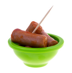 Hot and spicy bite size sausages with toothpick