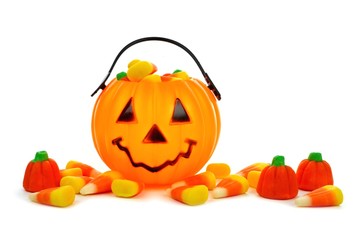 Cute Halloween Jack o Lantern candy collector with scattered candy pumpkins and candy corn over white