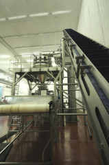 Close up scene. Factory interior, machines and equipment. Production line installment.