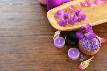 Beautiful composition of spa treatment on wooden table