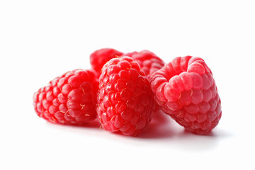 Red sweet raspberries isolated on white