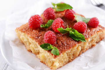 Fresh pie with raspberry on crumpled parchment, closeup