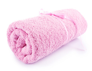 Rolled up colorful towel isolated on white