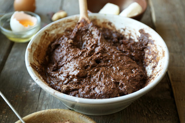 Preparing dough for chocolate pie on table close up