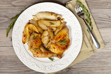 Garlic, Lemon and Rosemary Roasted Chicken. Selective focus.