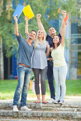 Group of happy students celebrating their succes