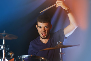 Drummer on dark background