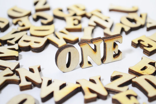 word "one" in wooden letters