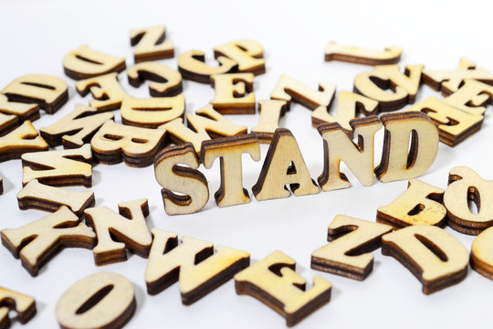 Word "Stand" in Wooden letters