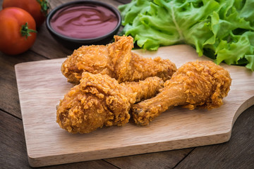Crispy fried chicken on wooden plate and dip sauce