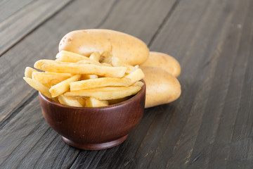 french fries on wood background
