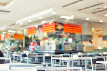Food court or foodcourt interior blurred background. May called restaurant or canteen include...