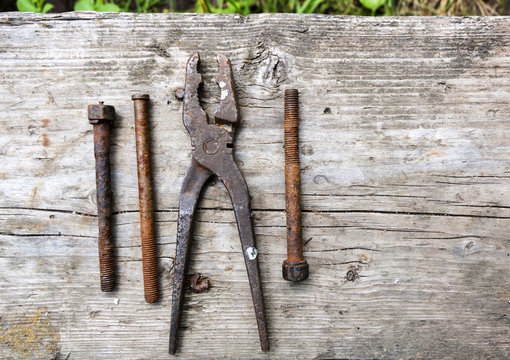 Vintage tools on a wooden background