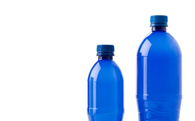 Bottles of soft drinks on white background
