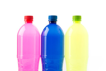 Bottles of soft drinks on white background