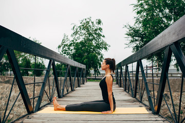 young slim woman doing yoga