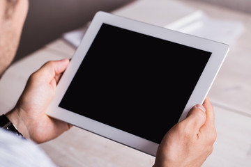 Tablet in male hands