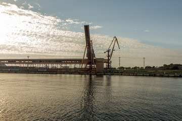 Fototapeta na wymiar port cranes in evening