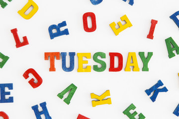 Series "Weekday": word Tuesday in wooden letters on white background
