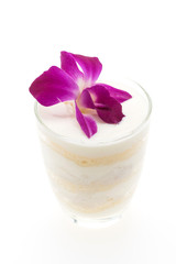 Coconut cakes with flower on top isolated on white background