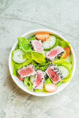 Grilled tuna salad in white bowl - healthy food