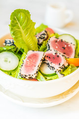 Grilled tuna salad in white bowl - healthy food